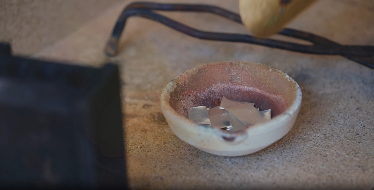 Load video: Video of the process of manufactoring by hand the mugo objects jewellery in italy. From the molten silver and gold to the finished bracelet